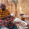 Mamma Hamidou earns up to eight US dollars a day selling peanut sauce, beans, flour and homemade spaghetti. (February 2019)