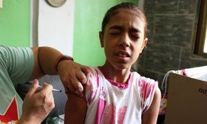 The Pan American Health Organization vaccinates children and adolescents against measles and diphtheria in South America.