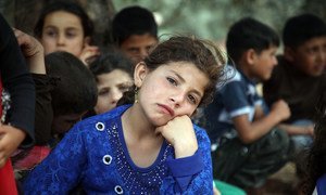 Families fleeing hostilities in Idlib set-up a makeshift camp in Aqrabat village, 45km north of Idlib City, near the Turkish border. (2019)