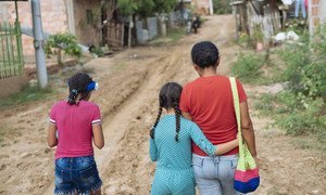 Nine-year-old Acnayeli (center) fled violence in Venezuela and lives now with her mother and sister in in Cucuta, Colombia. (April 2019)