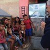 The head of the United Nations refugee agency, Filippo Grandi, meets Venezuelan refugee children during his visit to Brazil.