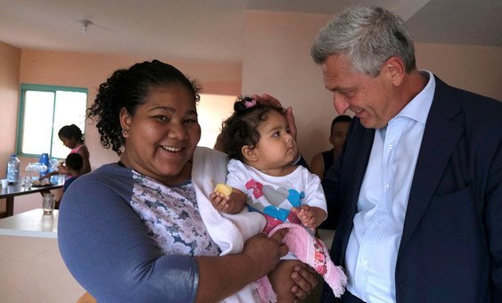 UN High Commissioner for Refugees, Filippo Grandi, talks to a recently arrived Venezuelan woman at a reception centre in Brasilia, Brazil. (15 August 2019)
