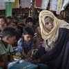 Nineteen-year-old Ruma travels about 30 mins by bus to teach the children at Kutupalong-Balukhali mega-camp in Cox's Bazar, Bangladesh. (June 2019)