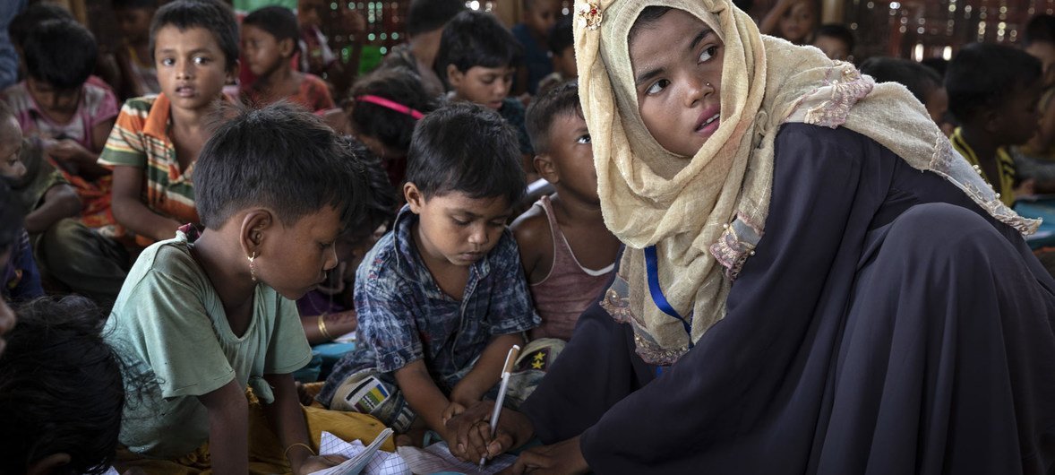 Nineteen-year-old Ruma travels about 30 mins by bus to teach the children at Kutupalong-Balukhali mega-camp in Cox's Bazar, Bangladesh. (June 2019)