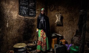 Bintu Mohammed, 13, stands in her home in Banki, northeast Nigeria, on 1 May 2019 after her home village was attacked four years ago and her school was destroyed. 