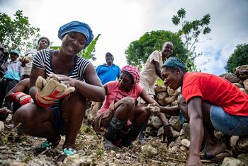 Women join a community effort to rehabilitate earthquake-damaged roads  in the south-west of Haiti.
