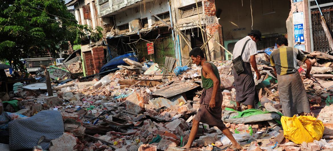 Earthquake survivors survey the ruins of their homes in Pyinmana, Myanmar following the earthquake there. Earthquake survivors survey the ruins of their homes in Pyinmana, Myanmar following the earthquake there.