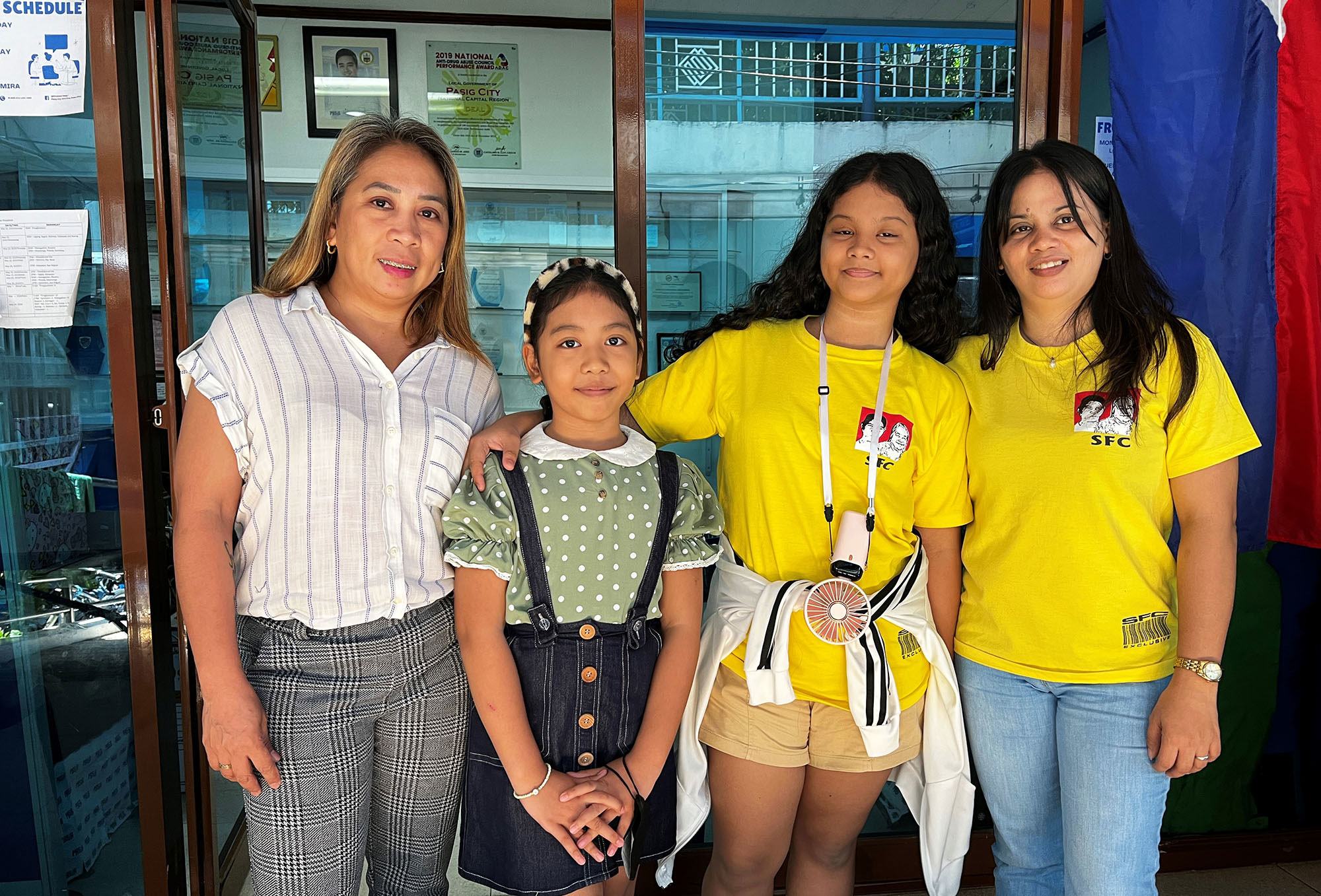 Arlene Alvarez (left) and Rowena Cruz (right) and their daughters Wasmiya and Angelique met at the Strong Families Programme in Pasig City, Philippines.