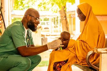 A baby is treated at a health centre in Nigeria.