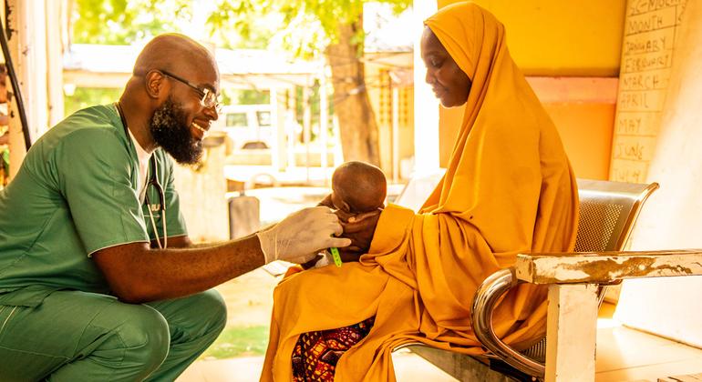 A baby is treated at a health center in Nigeria.