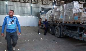 Trucks carrying lifesaving medical supplies arriving in Deir Al-Balah in central Gaza. Aid agencies warn that far too little aid is getting into the enclave while missions are frequently delayed.