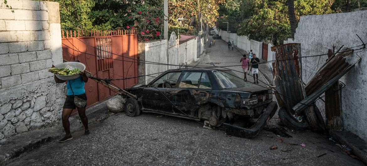 A road block is set up in a neighbourhood in Port-au-Prince in an attempt to prevent gang abductions.