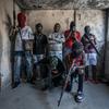 Gang members brandish their weapons in the Delmas 3 neighbourhood of the Haitian capital, Port-au-Prince.