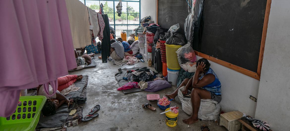 Families find refuge inside a school building in Port-au-Prince, Haiti.