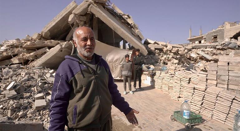 Abu Bilal shows his temporary shelter built under two concrete slabs to the left of his former residence.