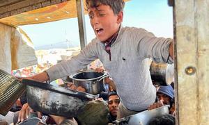 Gazans in Khan Younis desperate to receive WFP rice.