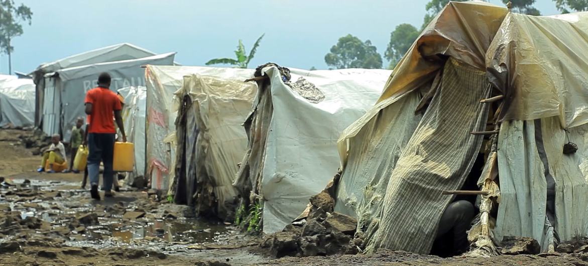 A man carries water in a camp for displaced people in Goma, in the eastern Democratic Republic of the Congo.