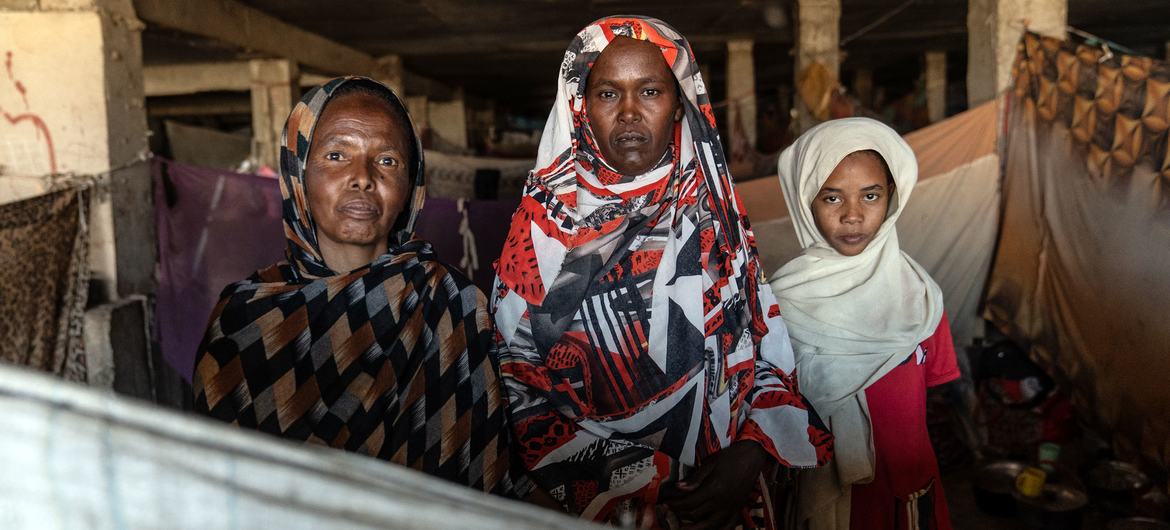 Families shelter in a former bus station turned displacement site in Gedaref, Sudan.