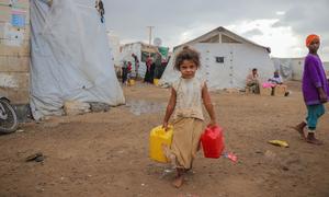 A child fetches clean water at a camp for displaced people in Dar Saad in Yemen. (file)