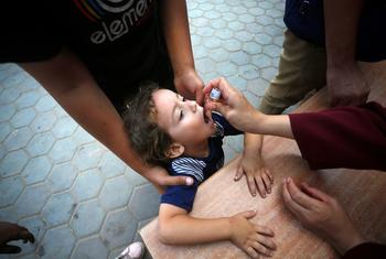 A health worker administers the polio vaccine to a Palestinian child in Deir Al-Balah in central Gaza. (file)