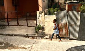 A young girl walks in Haiti's capital, Port-au-Prince.