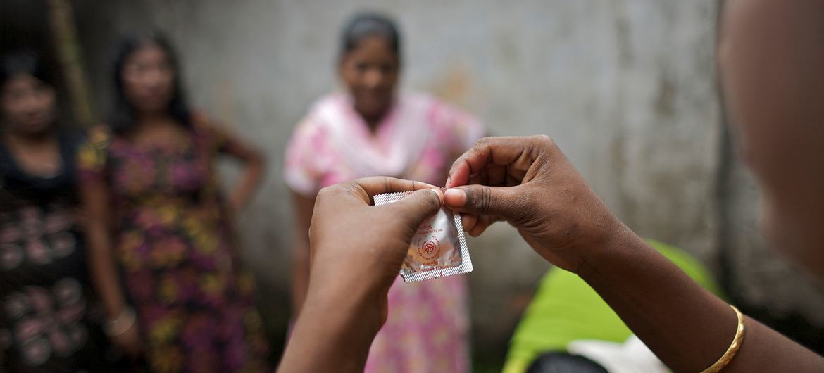 A peer educator speaks to a group of commercial sex workers in Bangladesh about the benefits of using condoms.