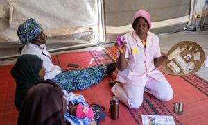 A midwife explains contraceptive options to women at a camp for displaced people in Chad.