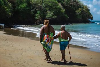 Arlene (left) takes every opportunity to include her mother in her walks along the beach in Belle Garden, Tobago.