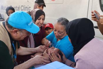 UN staff administer polio vaccines at a health clinic in Deir al-Balah, Gaza, in September 2024.