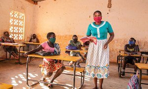 A teacher and her students wear facemasks at a primary school in Malawi.