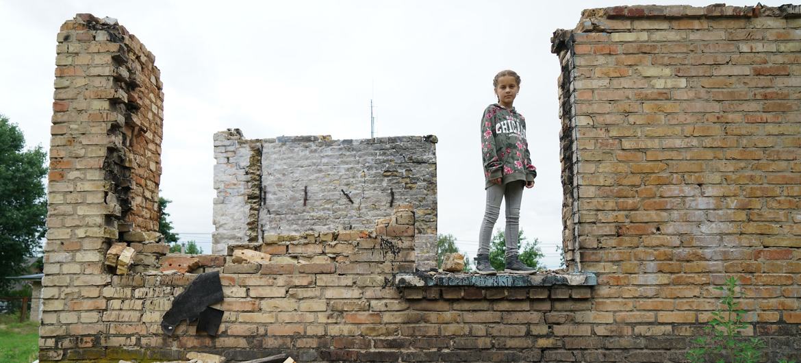 A young girl stands in the rubble of her school in a suburb of Kyiv in Ukraine. (file)