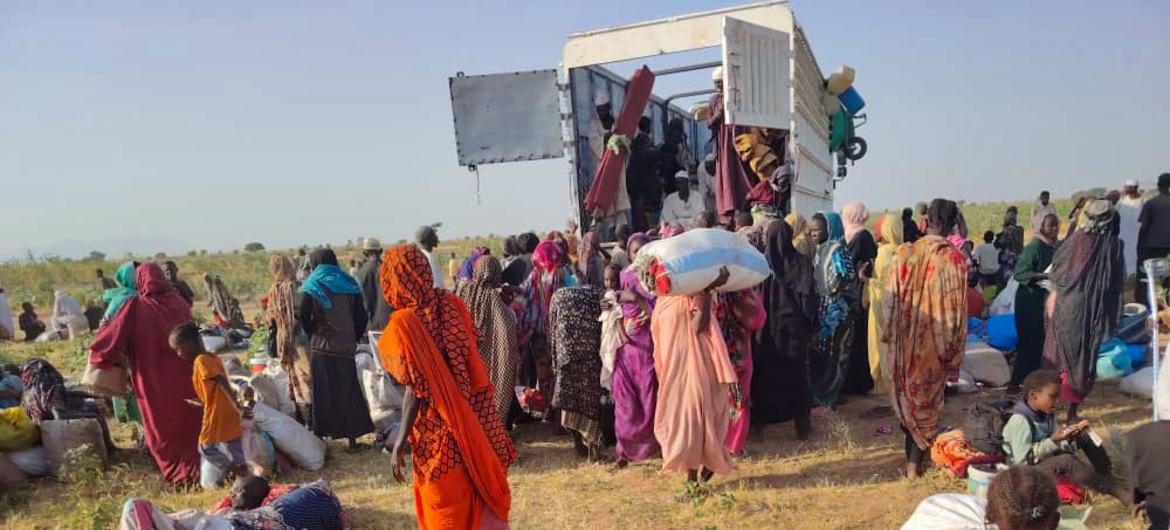 People who have fled El Fasher in Darfur receive aid in Tawila. People who have fled El Fasher in Darfur receive aid in Tawila.
