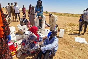 An aid worker provides first aid to an IDP at the Tawila displacement site in North Darfur, Sudan, on October 28, 2025.