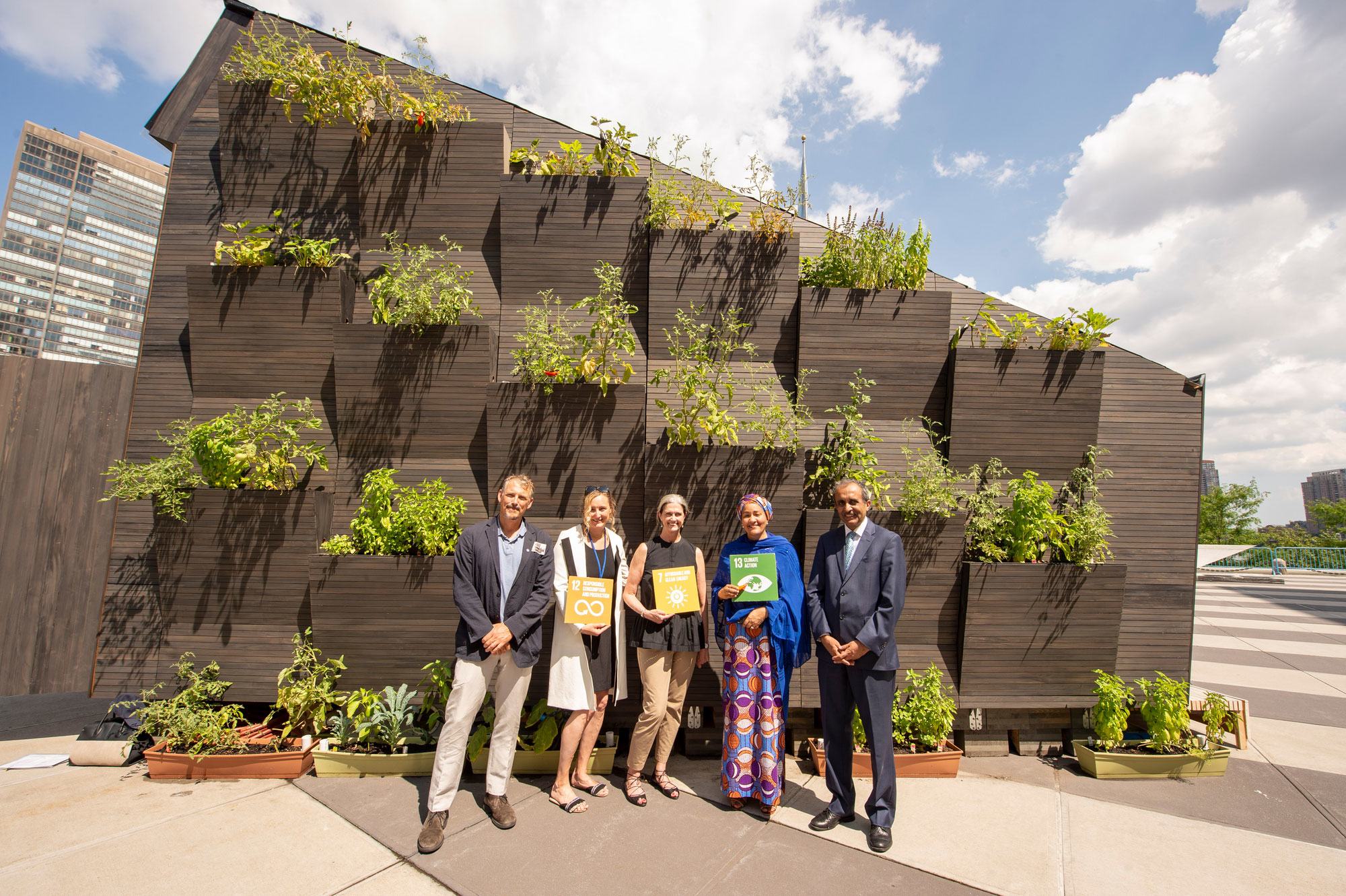 Deputy Secretary-General Amina Mohammed (2nd right) visits an Ecological Living Module, a demonstration of eco-friendly and affordable housing exhibited at UN Headquarters in New York. (file)