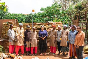 Sindhoor Pangal (center) worked with Masons Ink and a team of women masons to create her mud home.