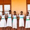 Girls give the thumbs-up at a school in Ghana.