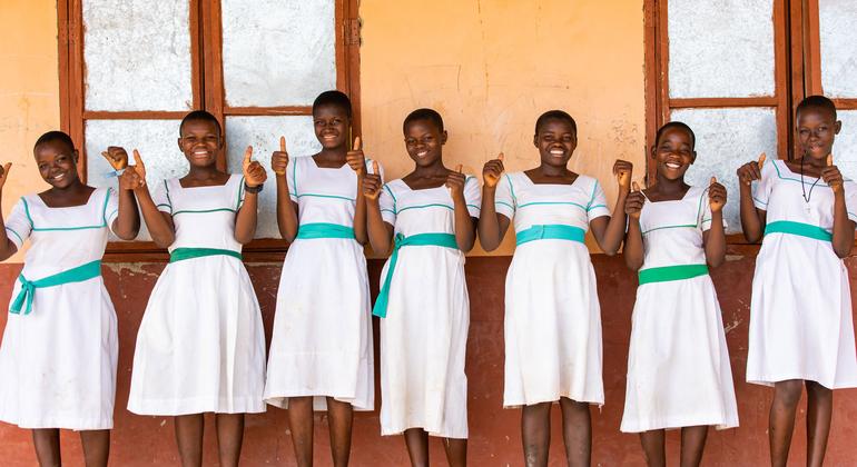 Girls give the thumbs-up at a school in Ghana.