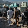 A funeral procession passes through the Grand Cemetery in downtown Port-au-Prince, Haiti