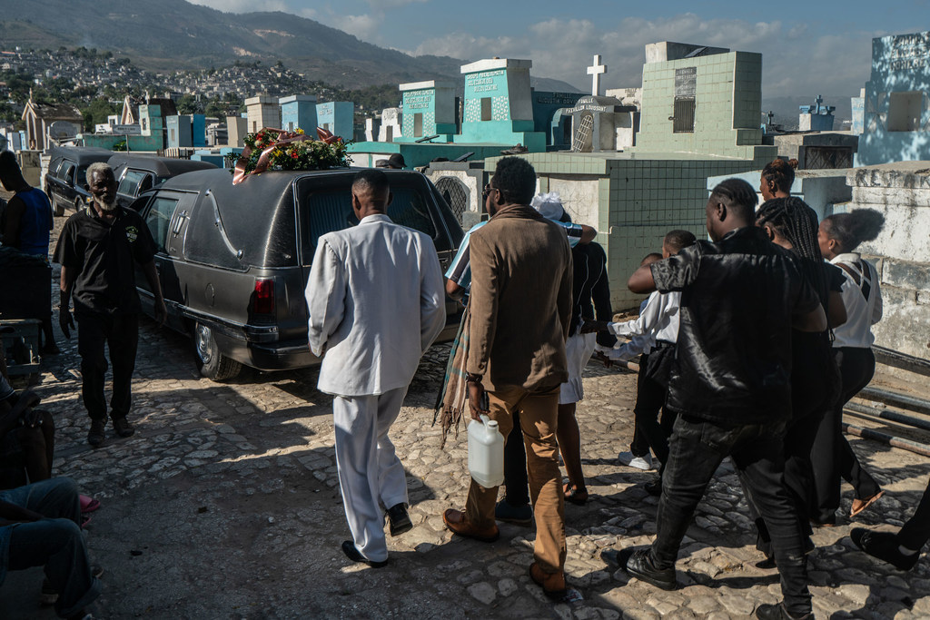 A funeral procession passes through the Grand Cemetery in downtown Port-au-Prince, Haiti