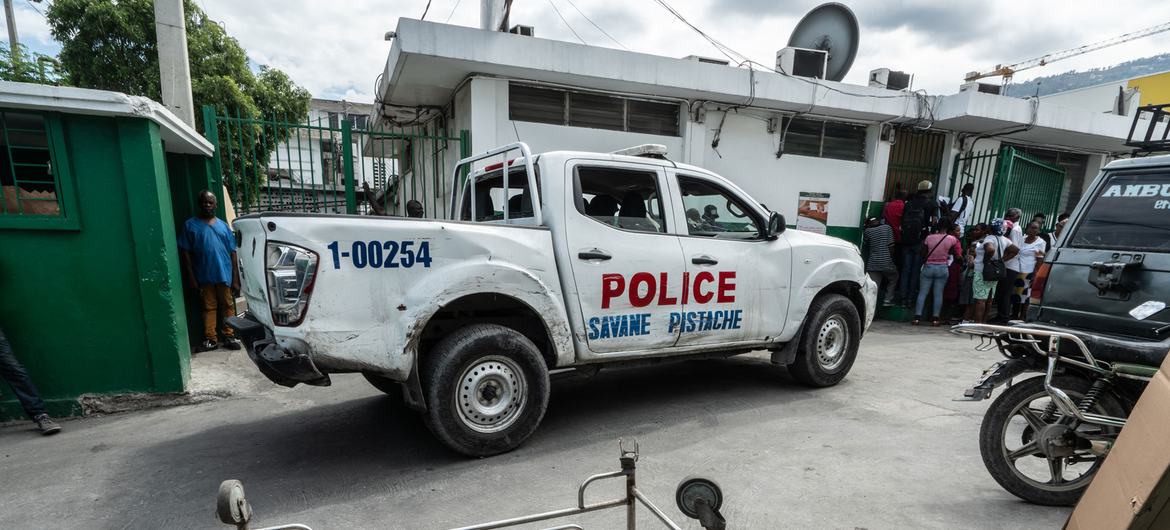 A police car passes by the General Hospital in Port-au-Prince.