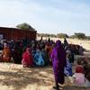 People wait for the distribution of emergency food and nutrition assistance in West Darfur.
