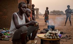 An internally displaced woman selling cassava sticks, the main staple in the Central African Republic, at a site for displaced people in Batangafo.