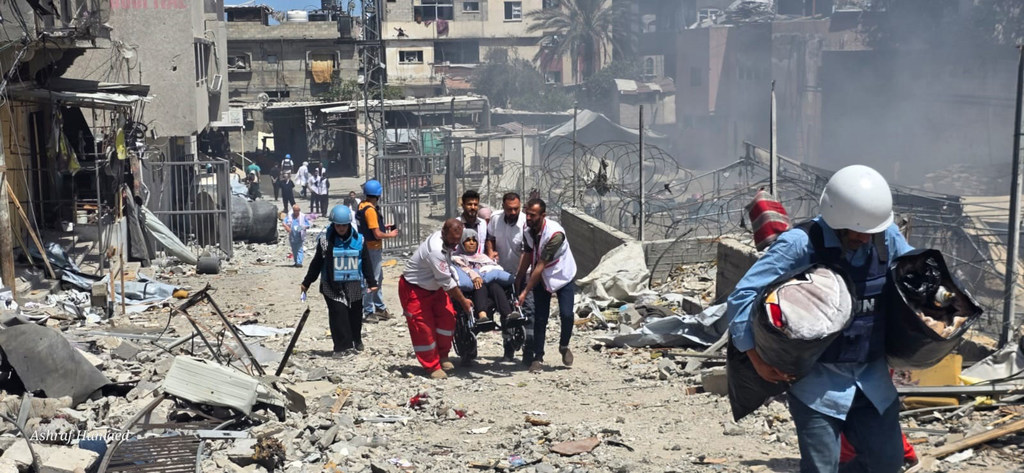 UN staff and medical workers evacuating patients from a hospital in northern Gaza in late May 2025.
