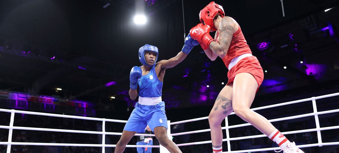 Refugee athlete Cindy Ngamba (left) is set to become the first ever medalist for the Refugee Olympic Team.