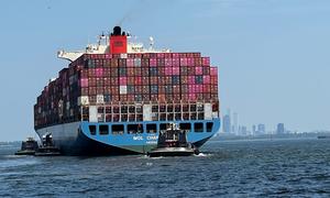 A container ship arrives in New York harbour in the United States.