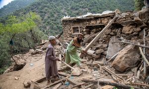 A father and son clear rubble following an earthquake in early September in Kunar province, Afghanistan.
