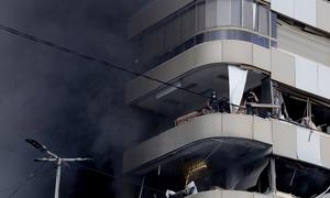 Smoke rises from a building following an airstrike in the southern suburbs of Beirut. (file)