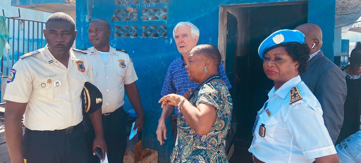  William O'Neill (centre background) visits a detention centre in Haiti.