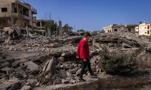 A five-year-old walks amongst the ruins of houses in southern Lebanon.