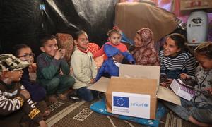 Children and their families in central Gaza receive winter clothes.